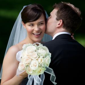 Groom kissing bride