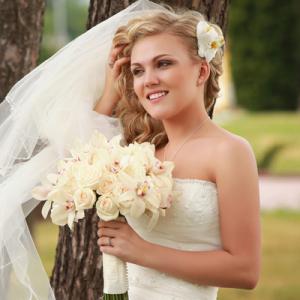 Young bride posing outdoors