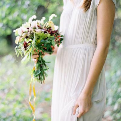 Bohemian inspired wedding dress at altar