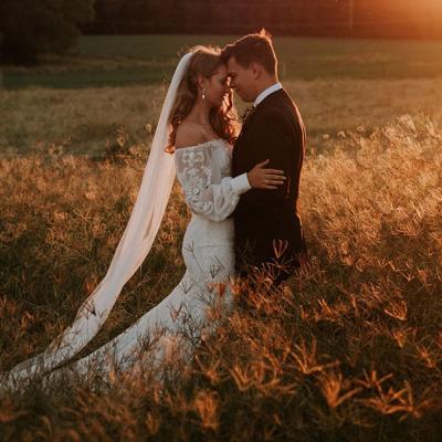 Bride and Groom together, with bride wearing a When Freddie Met Lilly gown.