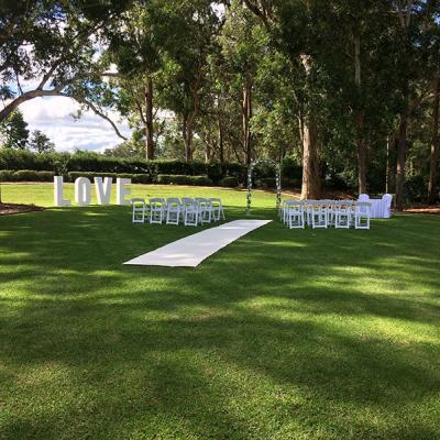 Outside wedding ceremony on the lawn at Highfields Cultural Centre