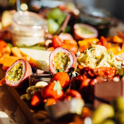 Grazing table laiden with lots of colourful food