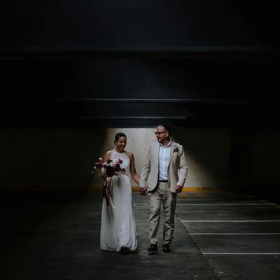 Bride & Groom, Mayumi + Sam holding hands.