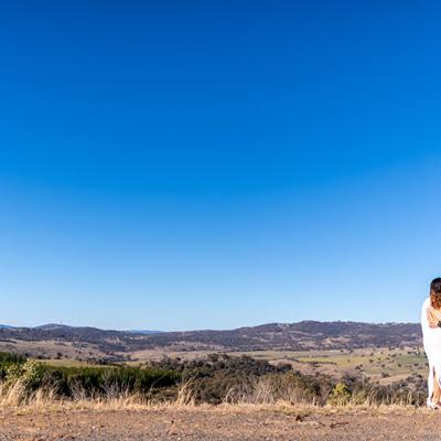 Bride and Groom together under a beautiful blue sky and country surrounds.