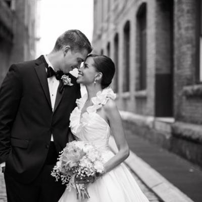 Bride and groom in street black and white photo