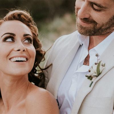 Bride smiling at Groom with beautiful white teeth.