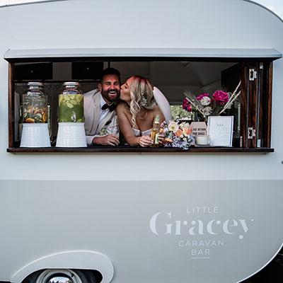 Bride and Groom in the Little Gracey Caravan Bar